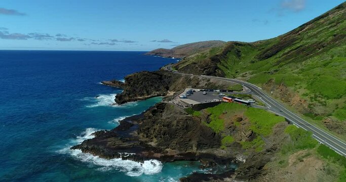 4K forward tracking drone aerial view of the Halona Blowhole and tourists watching the blowhole on the eastern side of  the island of Oahu,Hawaii,USA