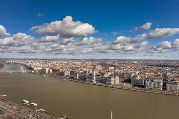 Fototapeta premium Aerial drone shot of Hungarian Parliament with clouds in Budapest Winter morning