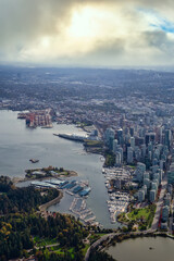 Downtown Vancouver, British Columbia, Canada. Aerial View of the Modern Urban City, Stanley Park, Harbour and Port. Viewed from Airplane Above during a sunny morning. Sunny Morning Artistic Render