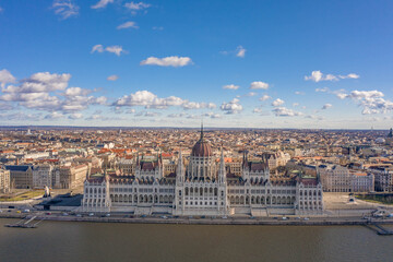 Aerial drone shot of front facade Hungarian Parliament with clouds in Budapest Winter morning