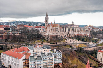 Obraz premium Aerial drone shot of Matthias Church on Buda hill during Budapest before sunrise in winter morning