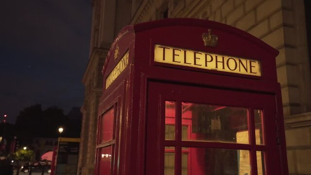 close view of typical beautiful unique london red telephone cabin at night time