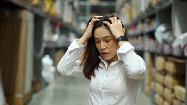 stressed female manager in the warehouse store