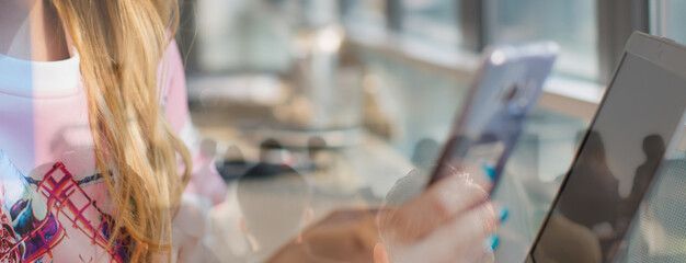 Smart working and video conference stock photo. Businesswoman speaking using webcam in meeting on laptop and smartphone with colleagues. Female employee talks on video call with coworkers online.
