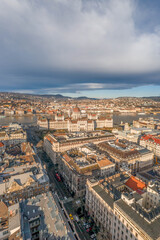 Aerial drone shot of Bathory street leading to Hungarian Parliament in Budapest winter morning