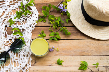 herbal health drinks hot milks green tea with hat ,sunglasses ,knitting wool of lifestyle woman...