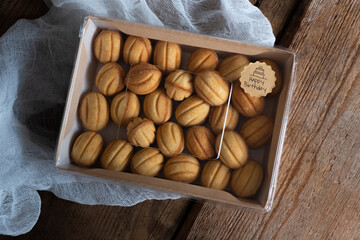  cookies nuts with caramel on an old wooden background