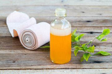 first aid with herbal oil medication liniment and bandage health care pains and aches for athlete...