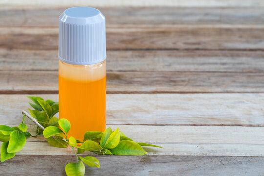 herbal oil medication liniment health care pains and aches for athlete decoration on background wooden