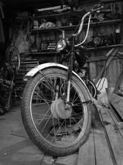 Naklejka na ściany i meble Vintage moped in the garage