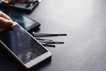 Smartphone with a broken touch screen. Mobile phone is broken. The phone crashed. Replacing broken glass on a cell phone. Smartphone repair.