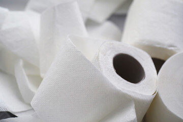 Toilet paper in a roll. Snow-white soft three-layer toilet paper. Lack of hygiene products. Primary protection and disinfection.