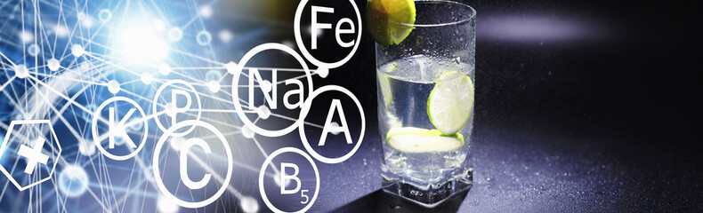 Lime water. Drinking water with fresh lime. Mineral water. Healthy, mineral-rich, refreshing water with lime.