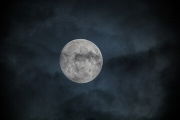 Fototapeta na wymiar Full Moon Behind Clouds