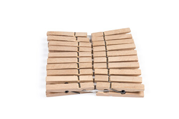 Set of wooden clothespins on a white background close-up