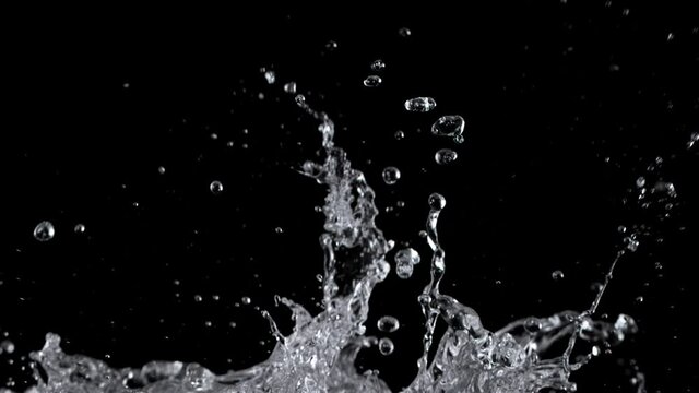 Water splashing on black background, super slow motion. Filmed on high speed cinema camera, 1000 fps.