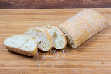 Partly cut ciabatta on the cutting board