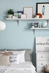 Interior of modern stylish bedroom with shelves
