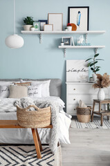 Interior of modern stylish bedroom with shelves