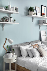 Fototapeta na wymiar Interior of modern stylish bedroom with shelves