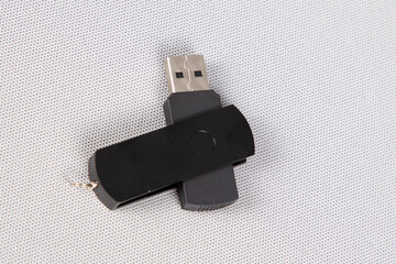 black usb flash drive lip turn open on grey background