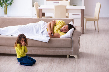 Obraz premium Small girl looking after her sick father