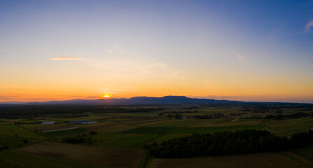 Naklejka na ściany i meble Panoramic aerial view of scenic sunset at Croatia countryside.