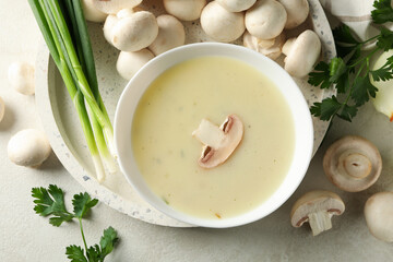 Concept of tasty lunch with bowl of mushroom soup, top view