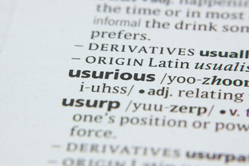 Word or phrase Usurious in a dictionary.
