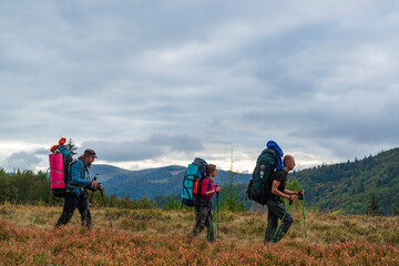 Fototapeta na wymiar Group of hikers on the mountain trail.