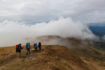 Group of hikers on the mountain trail.