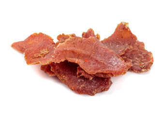 Spicy dry-cured meat isolated on a white background.