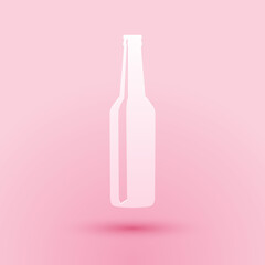 Paper cut Beer bottle icon isolated on pink background. Paper art style. Vector.