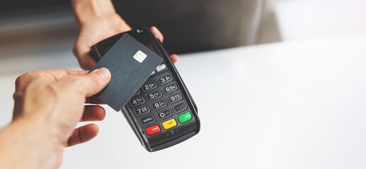 nfc contactless payment by credit card and pos terminal. copy space - Powered by Adobe