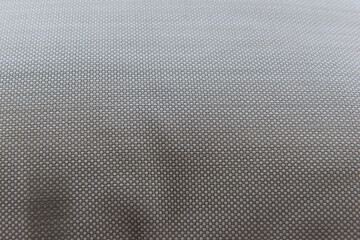 Gray fabric texture background close up. House abstract decorative element