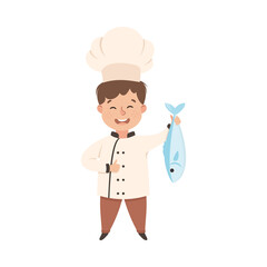 Cute Boy Chef Cooking Fresh Fish, Smiling Kid in Chef Uniform Cooking in Kitchen Cartoon Style Vector Illustration