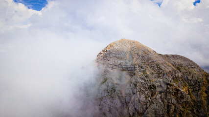 Mangart peak in the clouds