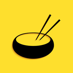 Black Bowl with asian food and pair of chopsticks silhouette icon isolated on yellow background. Concept of prepare, eastern diet. Long shadow style. Vector.