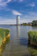 Modern living tower with reflection in the water in Schleswig, Germany