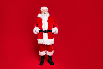 Full length body size view of his he nice attractive handsome content kind cheery Santa father wearing festal winter season look outfit newyear isolated bright vivid shine vibrant red color background