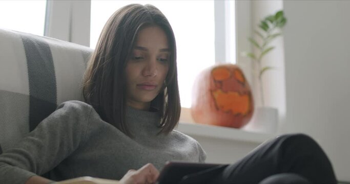 Mixed race woman working from home