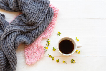 hot coffee ,knitting wool scarf and yellow flowers of lifestyle woman relax in winter season...
