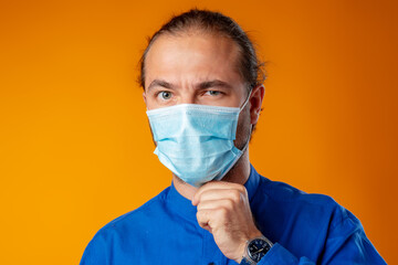 Middle-aged caucasian man wearing medical face mask.
