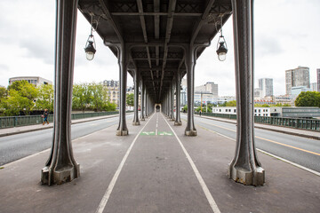 Cycle path under famous bridge in Paris, France.