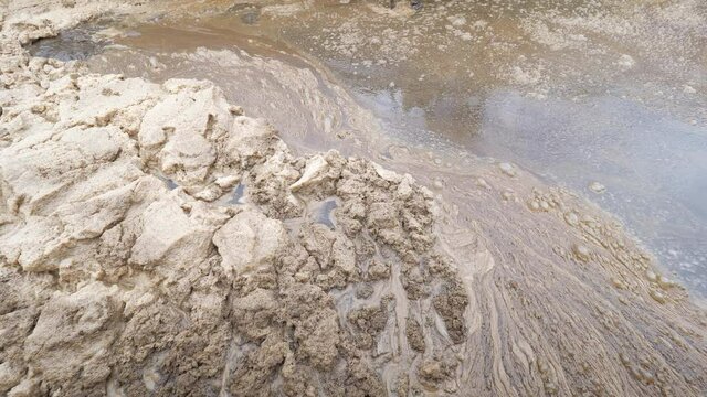 Detail of foam in huge concrete circular sedimentation tank Water settling, purification in the water station.