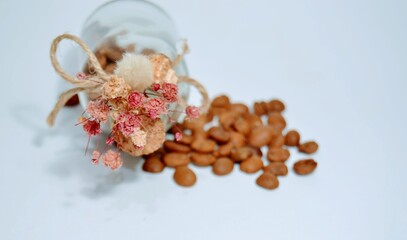 Fresh and dried coffee beans on the isolated background. Cute and small jar and old style wine...