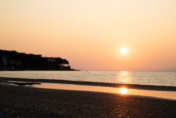 Scenic image of sunset reflection at the water, Croatia.