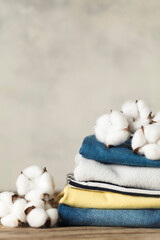 A stack of organic clothing and cotton colors. Eco friendly fabric shop.