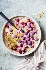Healthy breakfast concept. Oatmeal bowl with berries, chia and hemp seeds, top view.