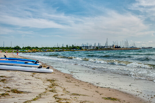 Surfboards on Marselisborg Strand convey sport, vacation and recreational concept. Surf boards on a beach provide illustration for surfer or windsurfer, leisure, hobby and relaxation - Aarhus, Denmark